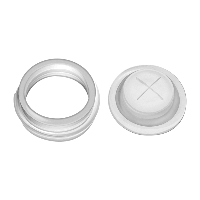 alt="A collection of different sized silicone cross slit valves arranged neatly."