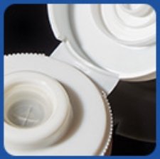 alt="Silicone valve cap with butterfly flip top for ketchup squeeze bottles"