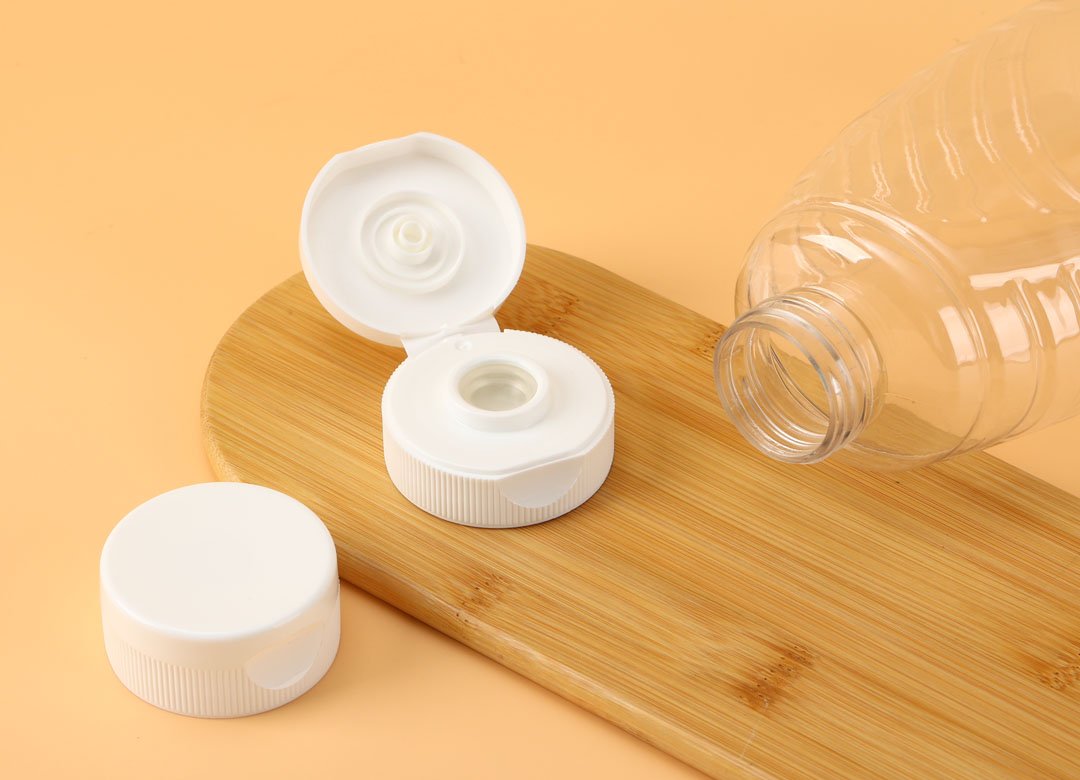 "flip top caps for bottles,minimal packaging with dispensing closure"