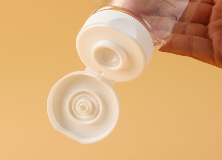 "Plastic flip top caps for bottles close-up view"