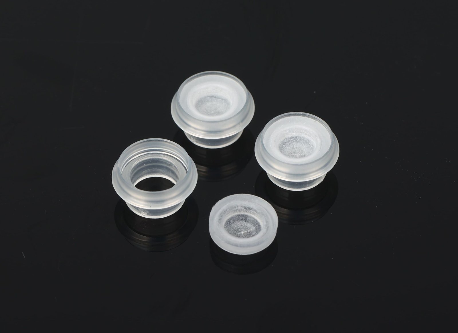 Silicone valve for HDPE bottles used in vacuum dispensing