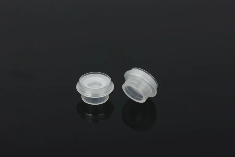"Silicone valve components for bottle caps before assembly"