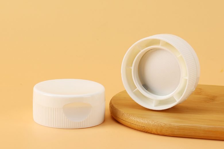 "flip top caps for toothpaste tubes design"